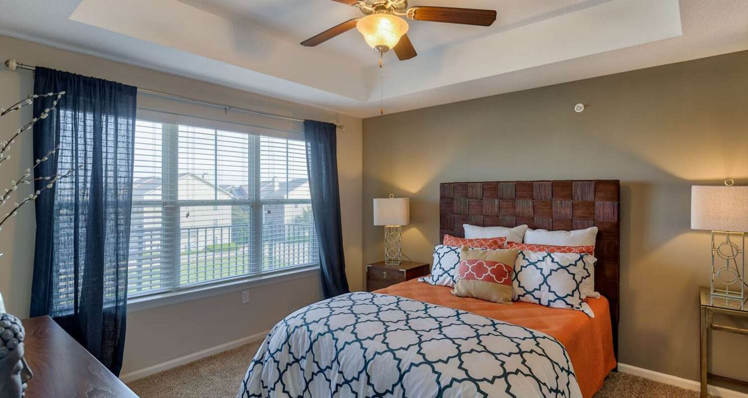 cozy bedroom at The Residences at New Longview in Lee's Summit, MO