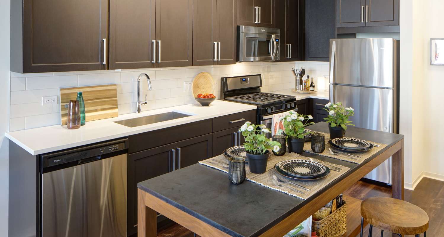 Kitchen with dark cabinets at Courthouse Square Apartments in Wheaton, IL
