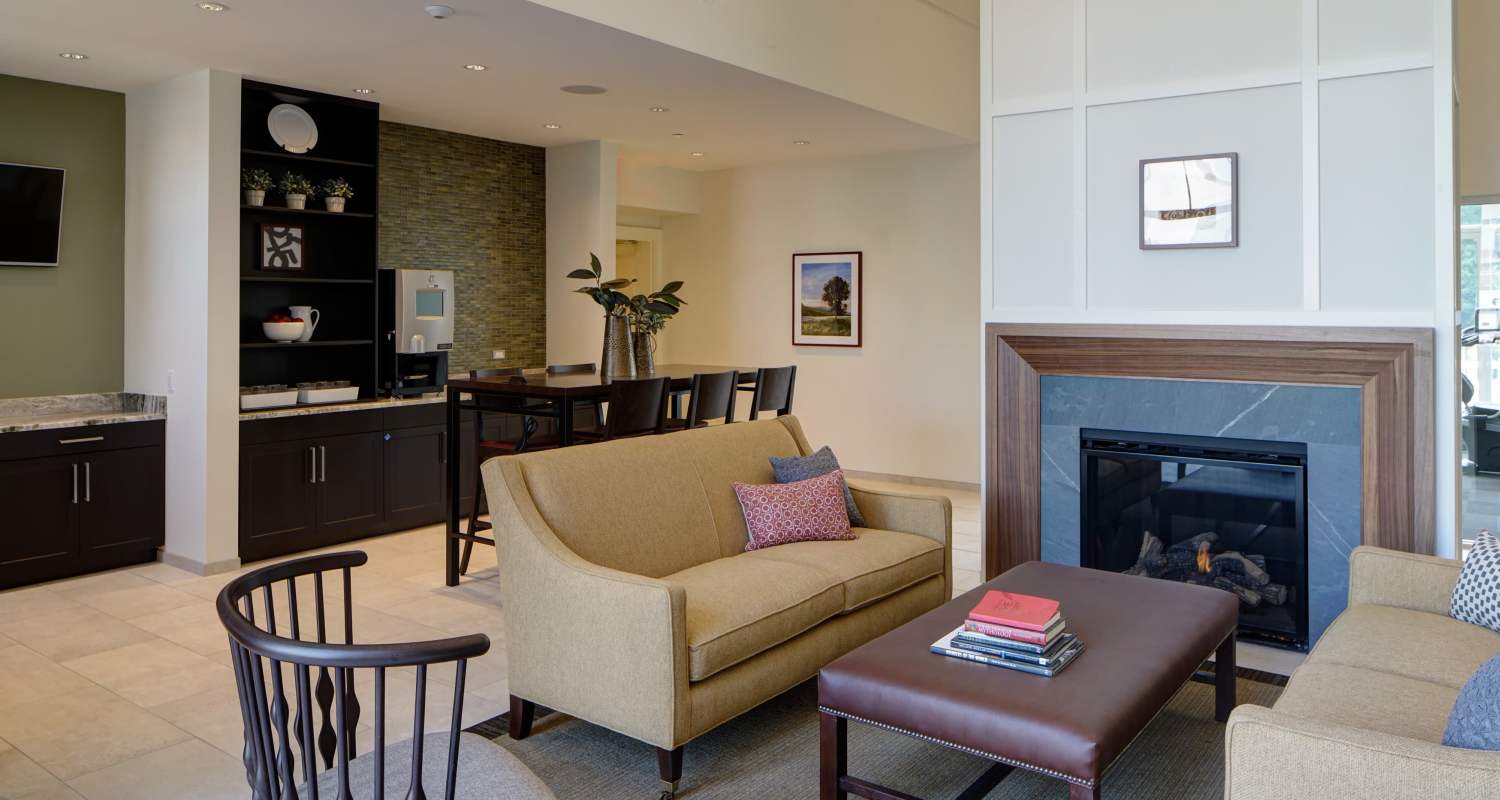 fireplace in lobby at Courthouse Square Apartments in Wheaton, IL