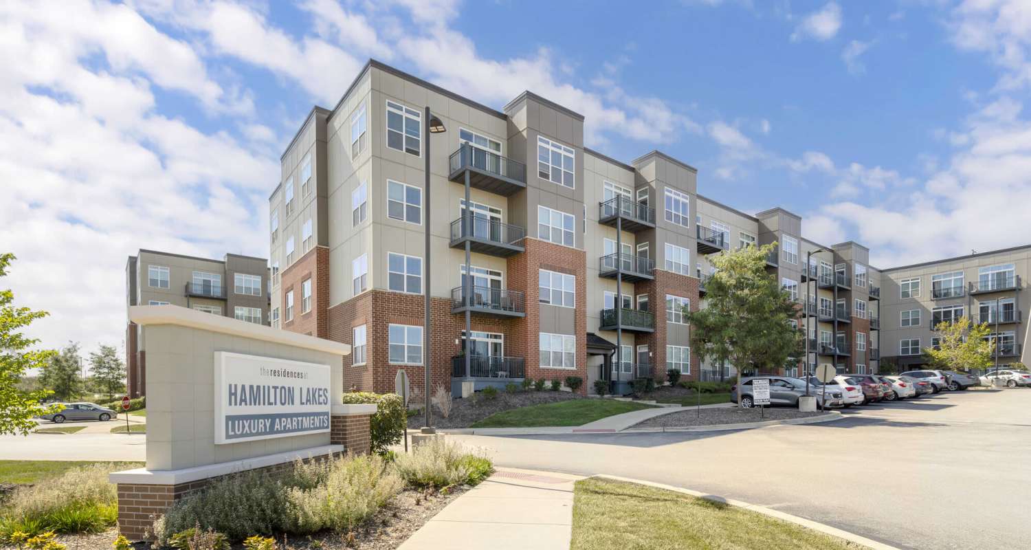 Exterior with signage at The Residences at Hamilton Lakes in Itasca, IL