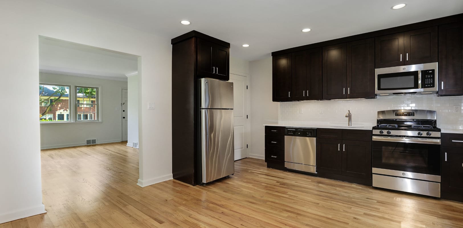 Kitchen with stainless steel appliances at Northfield Townhouses in West Orange, New Jersey