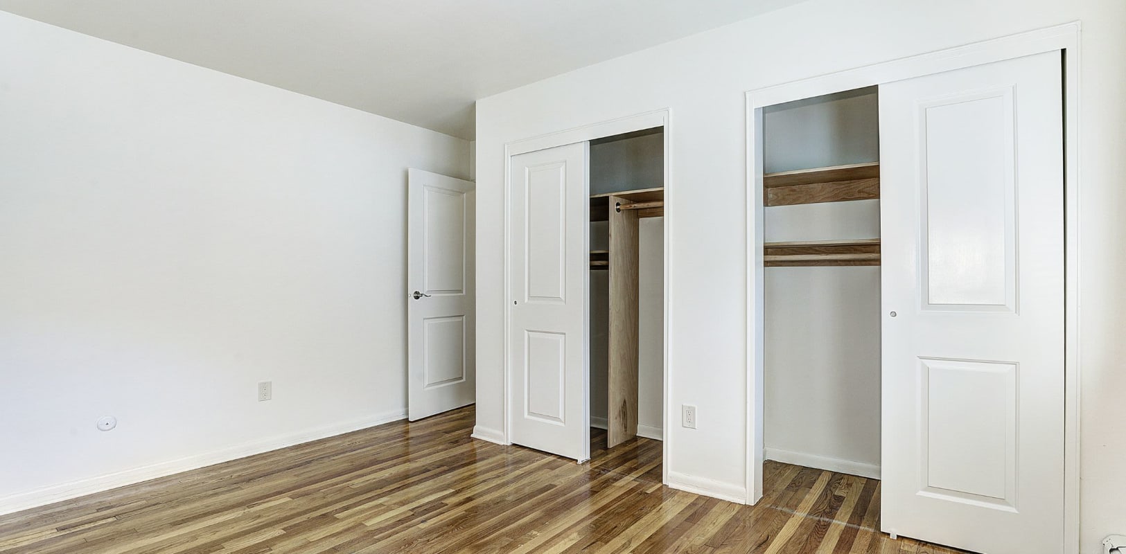 Bedroom with plenty of closet space at Garret Village Apartments in Clifton, New Jersey