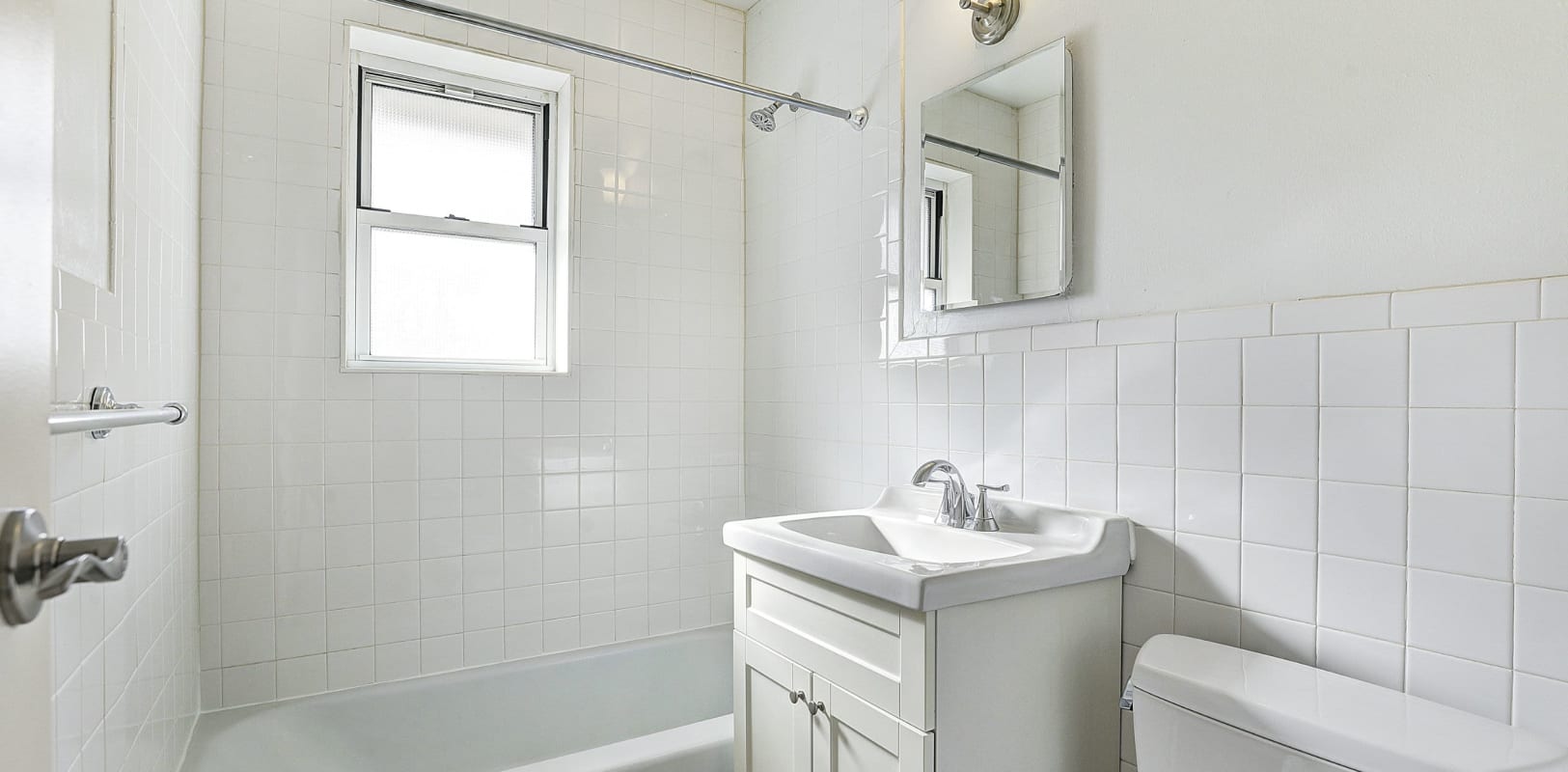 Clean bathroom at Garret Village Apartments in Clifton, New Jersey