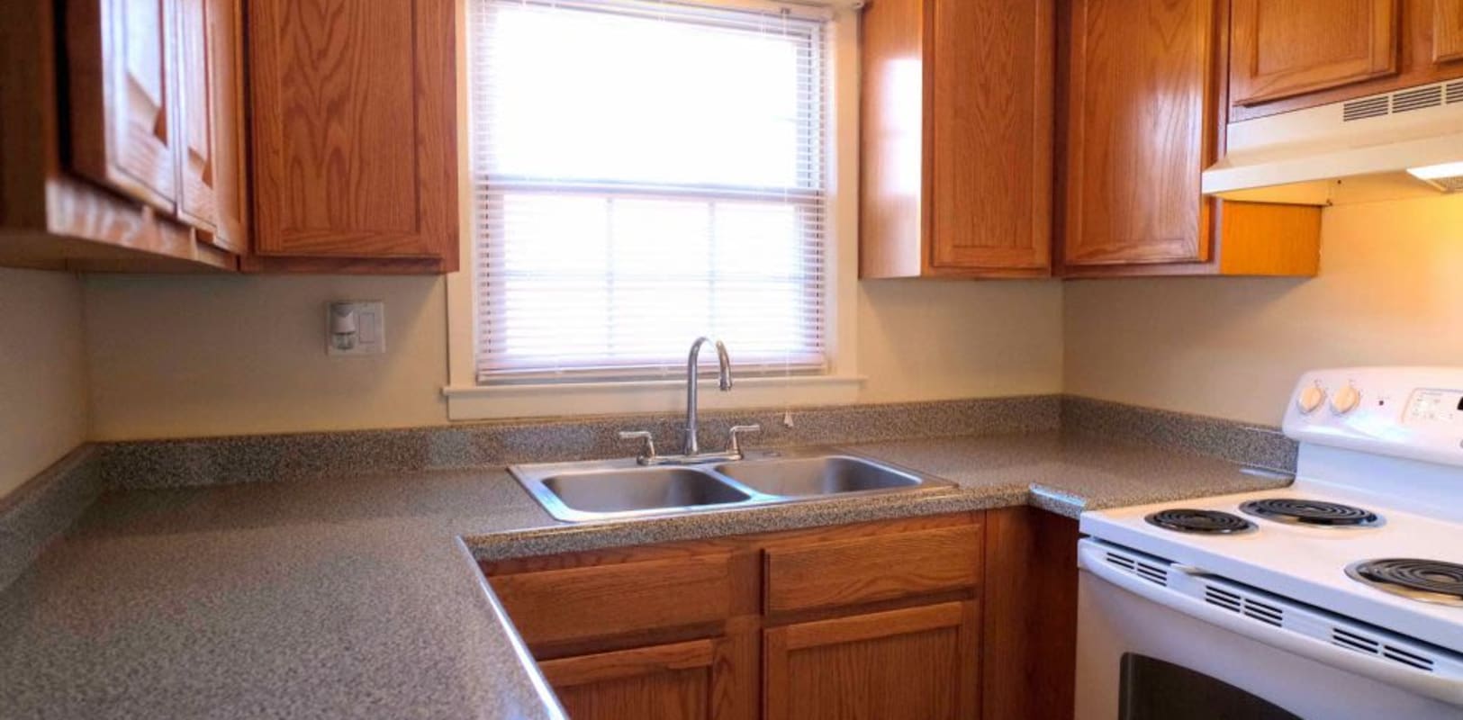 Kitchen with a large window at Hillside Terrace Apartments in Newton, New Jersey
