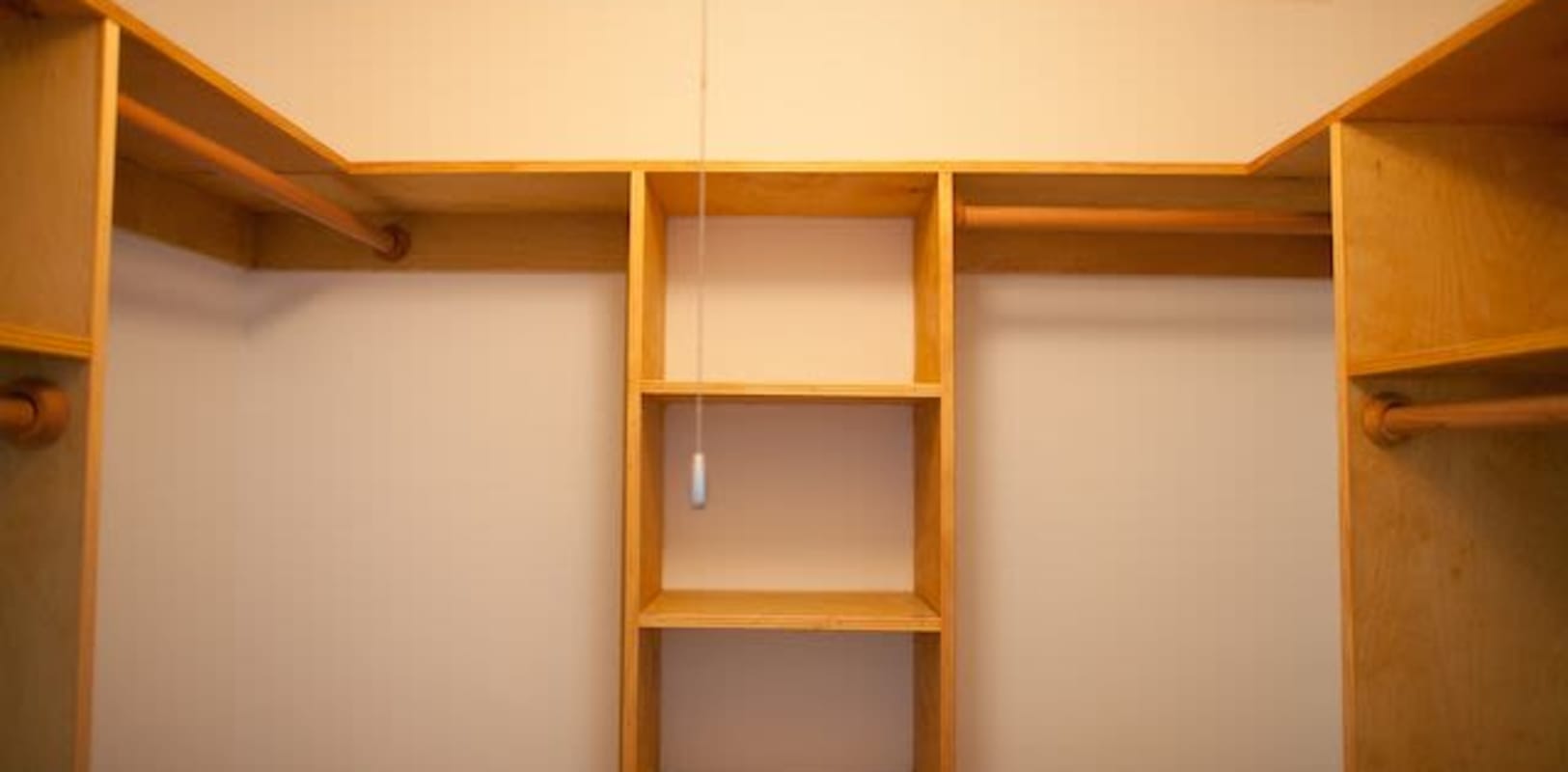 Ample closet space and wooden style shelves at Marina Park Apartments in Collingswood, New Jersey