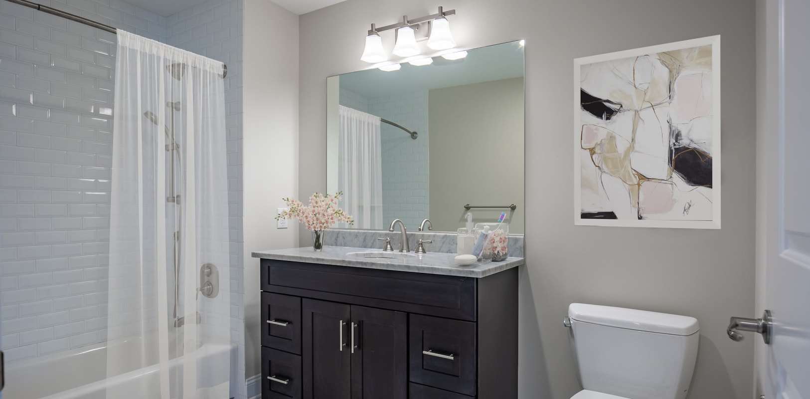 Modern bathroom with black vanity at Zephyr Ridge in Cedar Grove, New Jersey