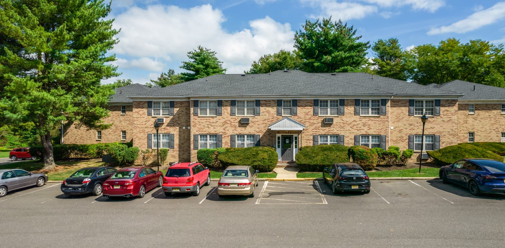 Parking Lot and buildings at Sharon Arms Apartments in Robbinsville, New Jersey