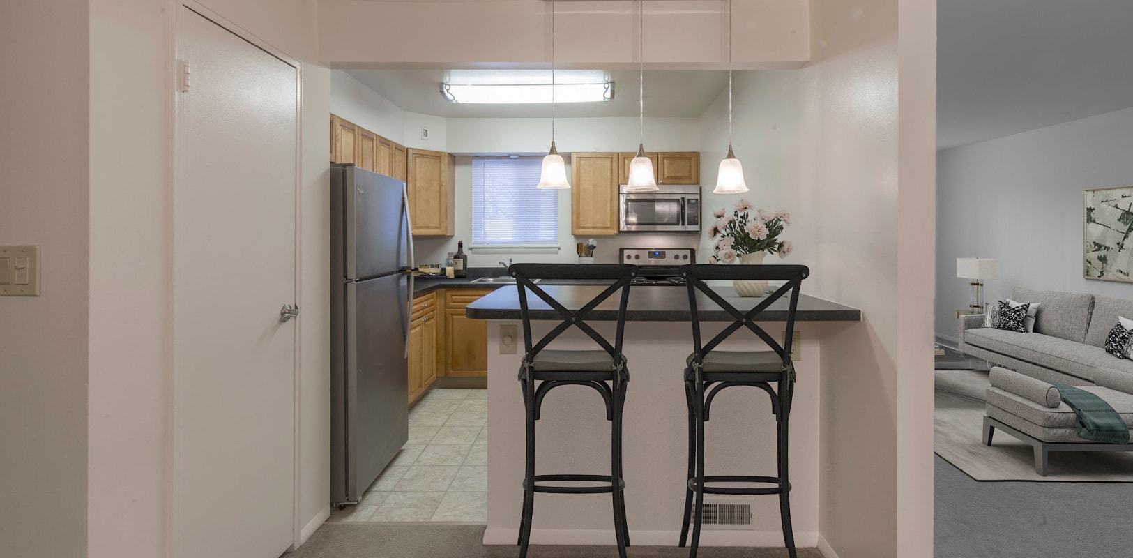 Kitchen featuring breakfast bar seating at Penn Crest Apartments in Allentown, Pennsylvania