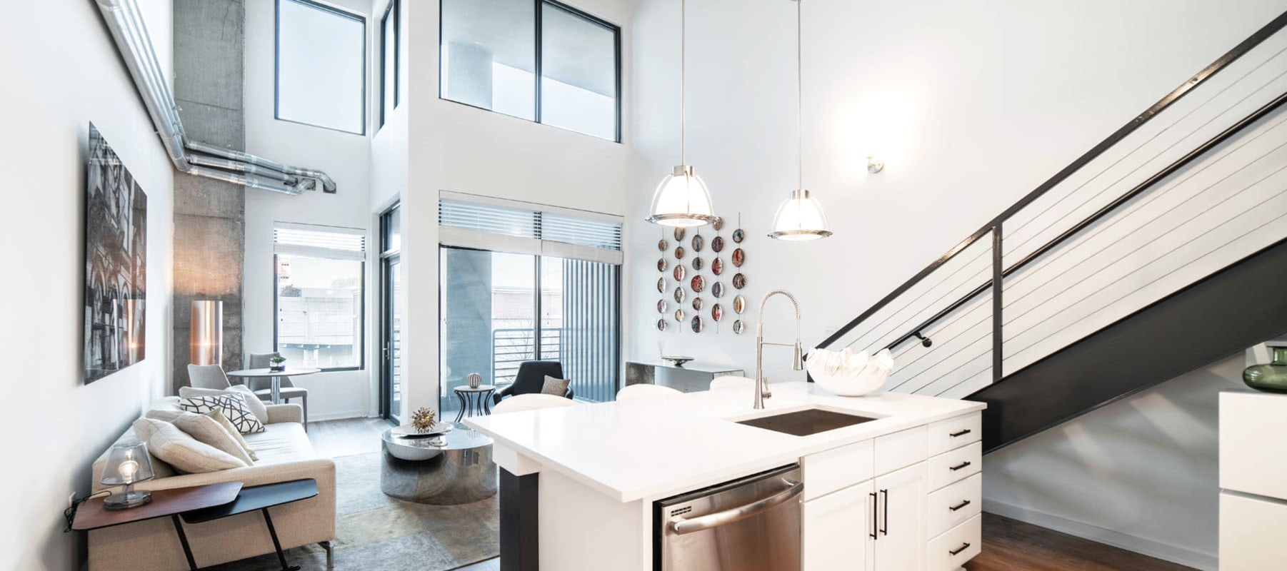 Bright and open layout in a model loft home at 17th Street Lofts in Atlanta, Georgia