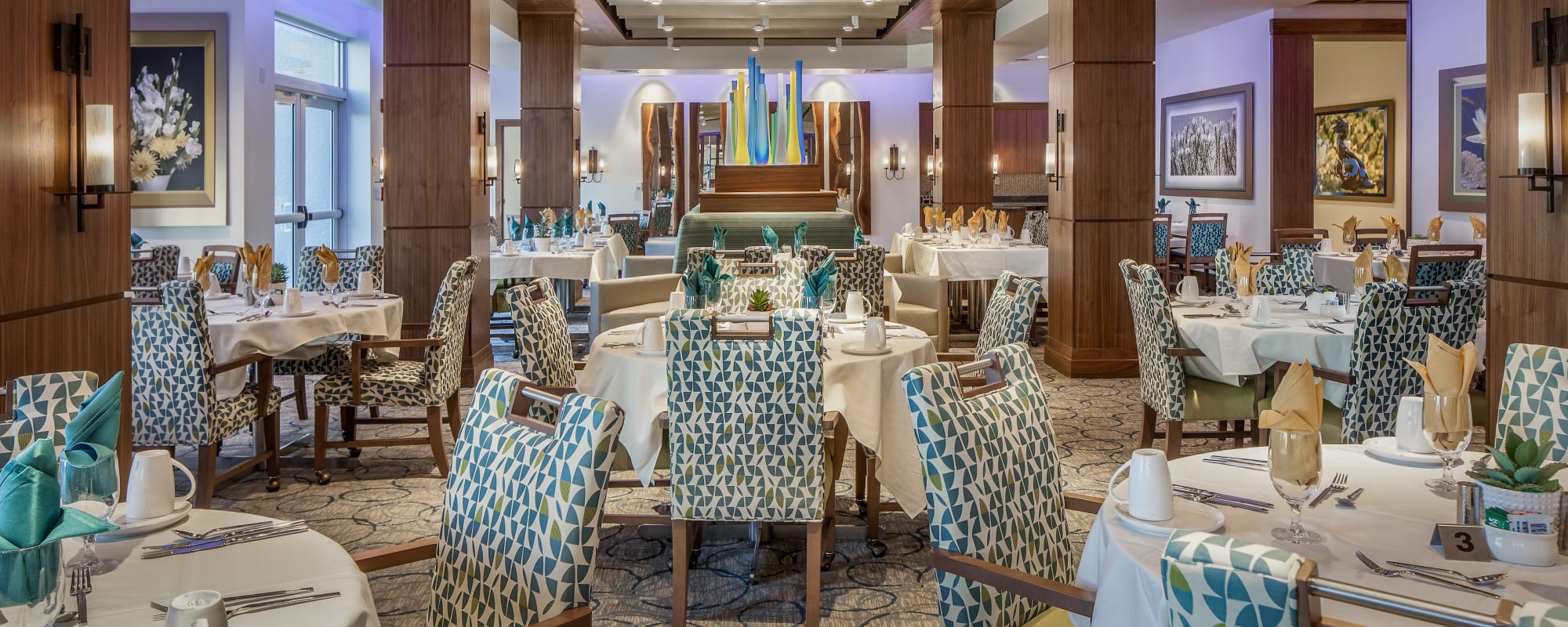 Beautifully decorated grand dining hall at one of our communities at All Seasons Senior Living in Farmington Hills, Michigan