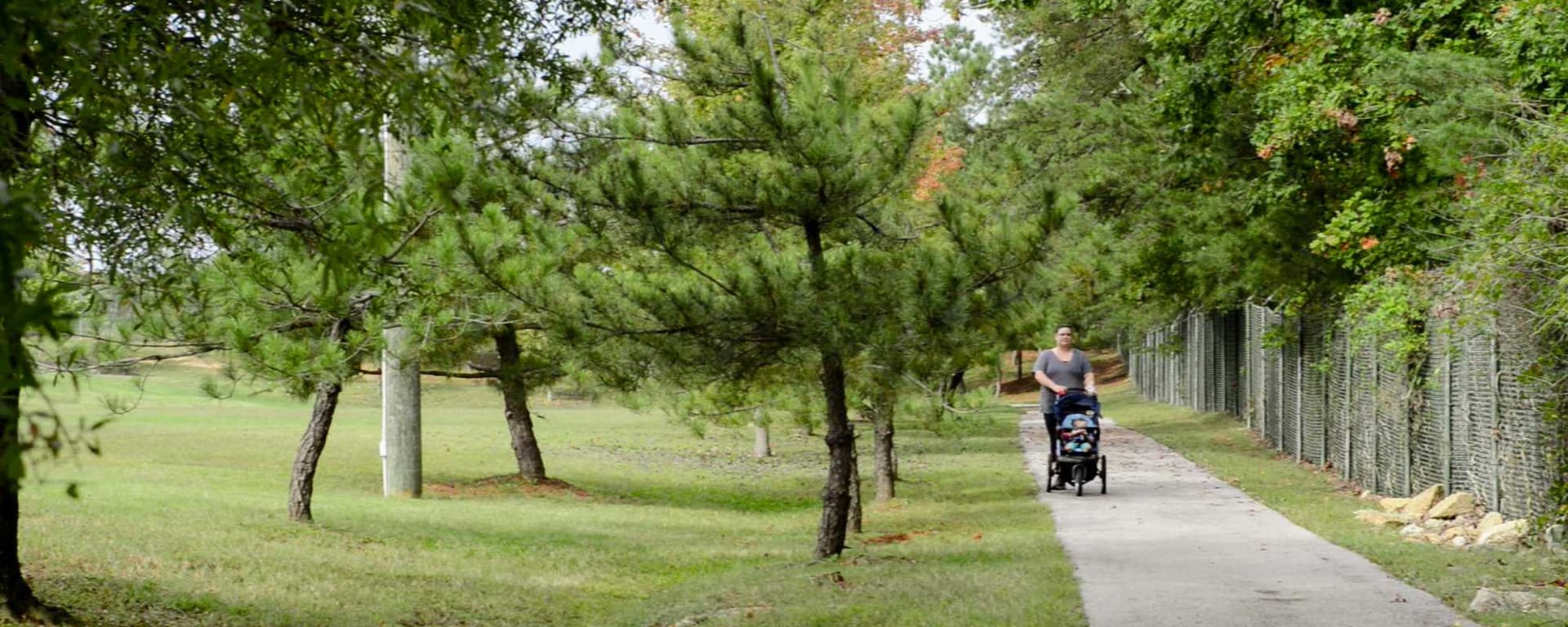 Woman pushing stroller at Glenn Forest in Lexington Park, Maryland