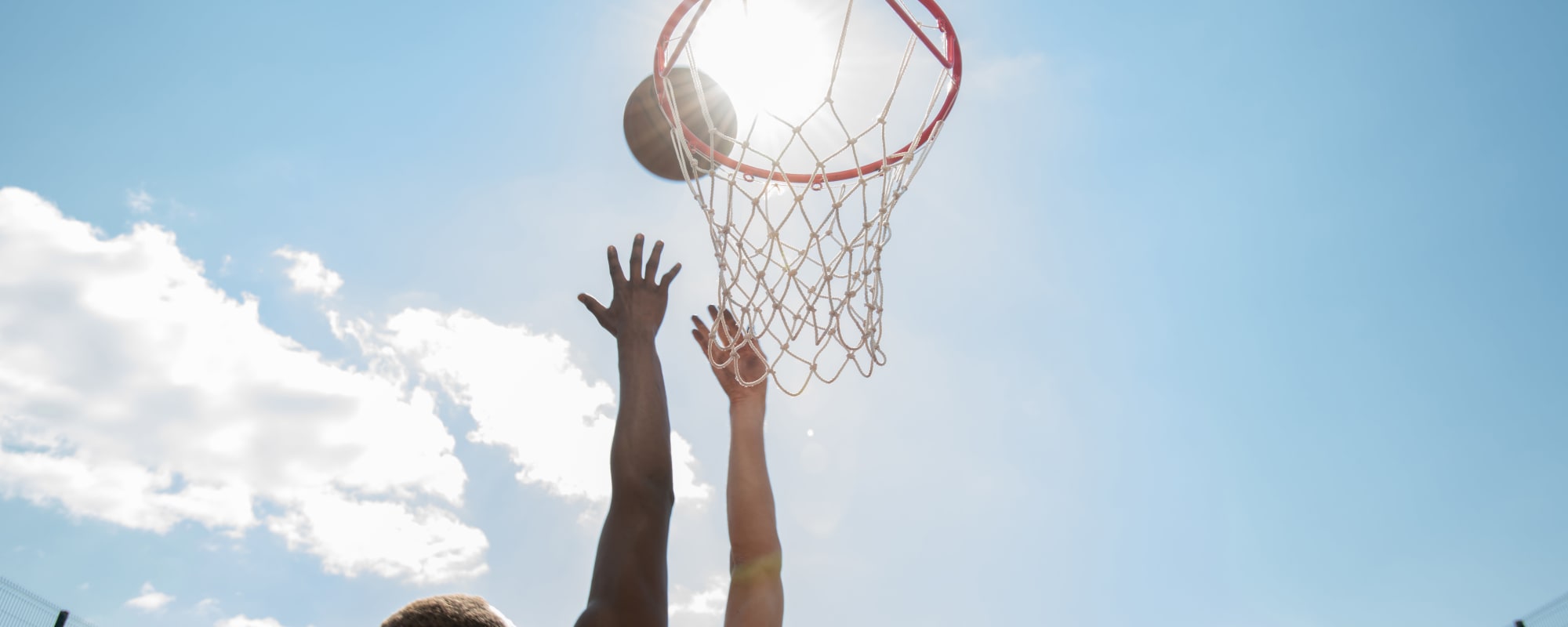 two residents playing basketball at Eucalyptus Ridge in Lakeside, California