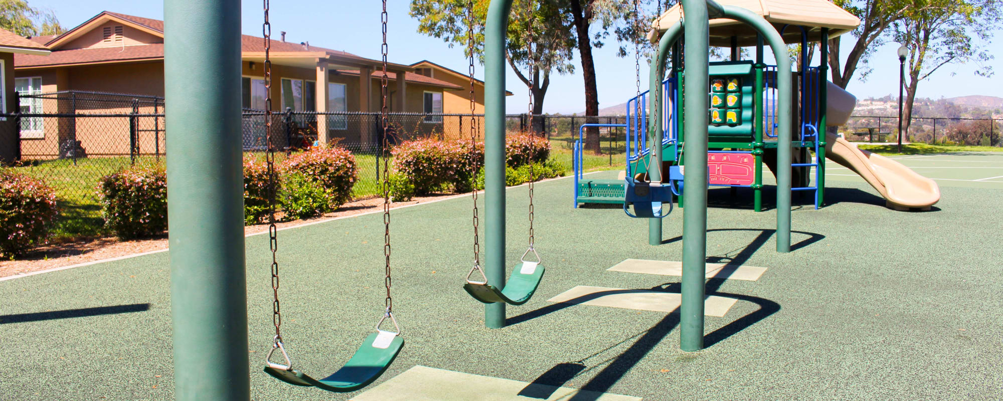 A playground with swings at Canyon View in San Diego, California