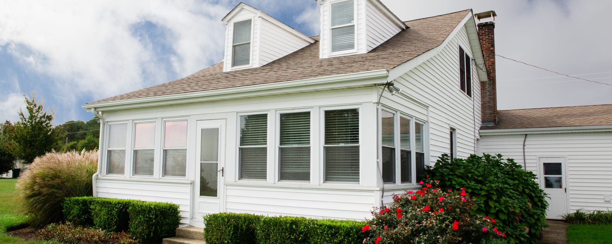 a sunny single-family home exterior at Gold Coast in Patuxent River, Maryland