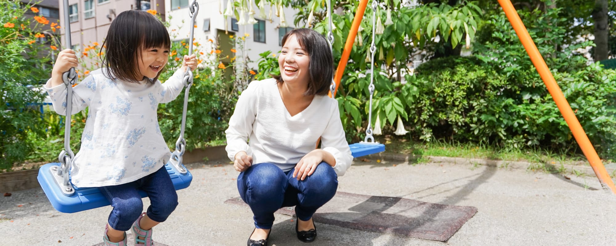 a mother and daughter on the swing set at Perry Circle Apartments in Annapolis, Maryland