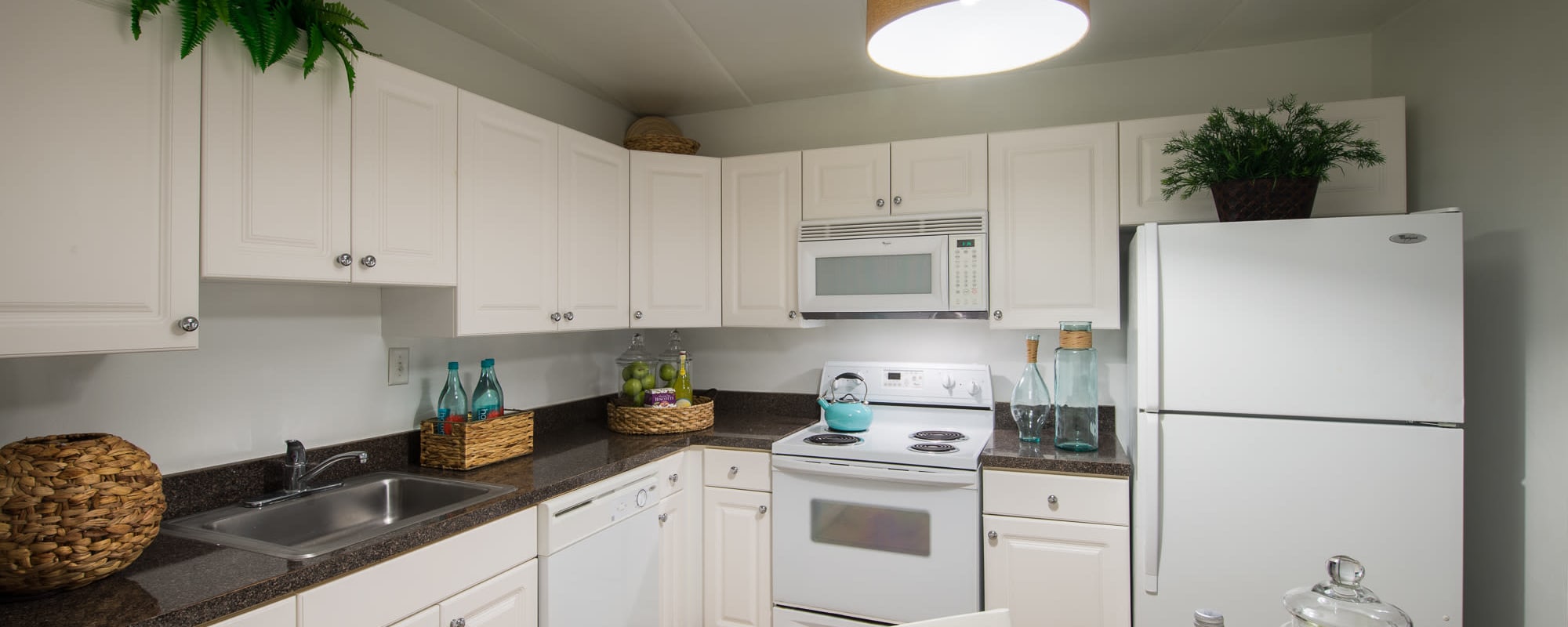 White cabinets in a modern apartment kitchen at Claremont Towers in Hillsborough, New Jersey