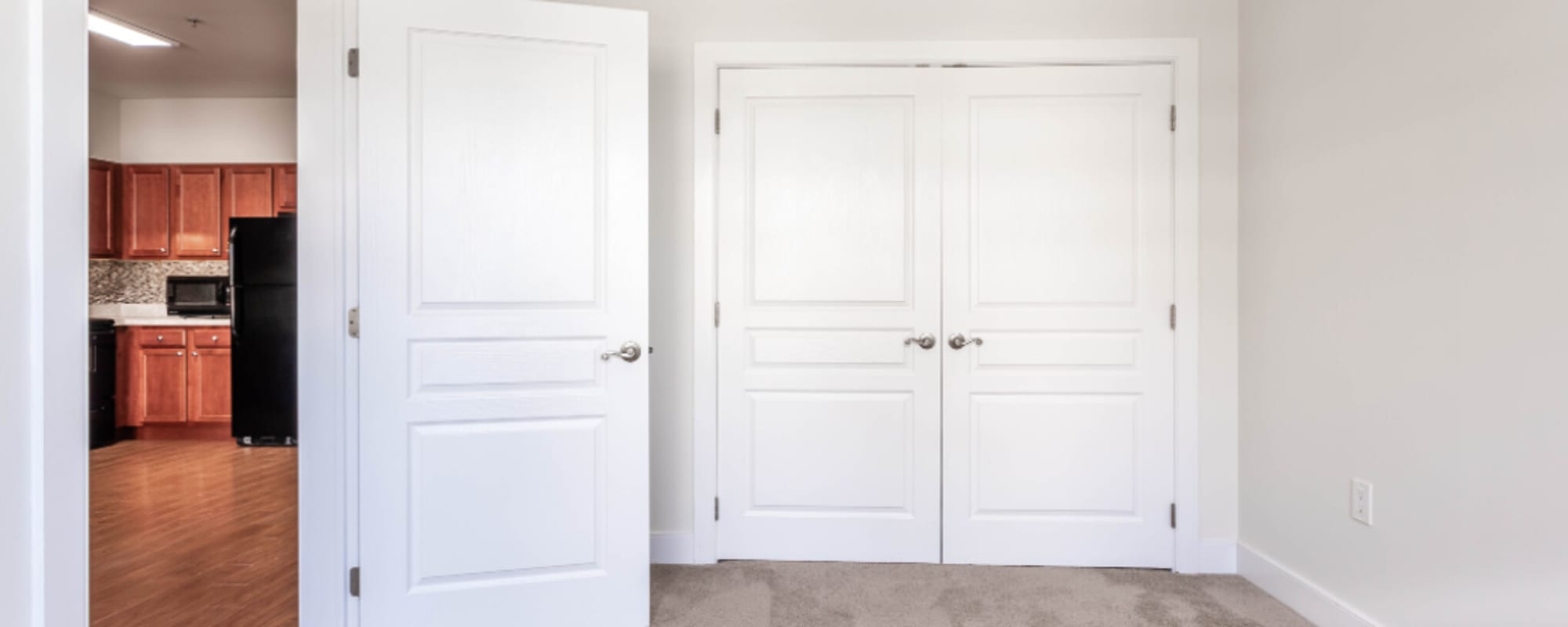 Open door to an apartment bedroom at Grand Meridia Apartments in Rahway, New Jersey