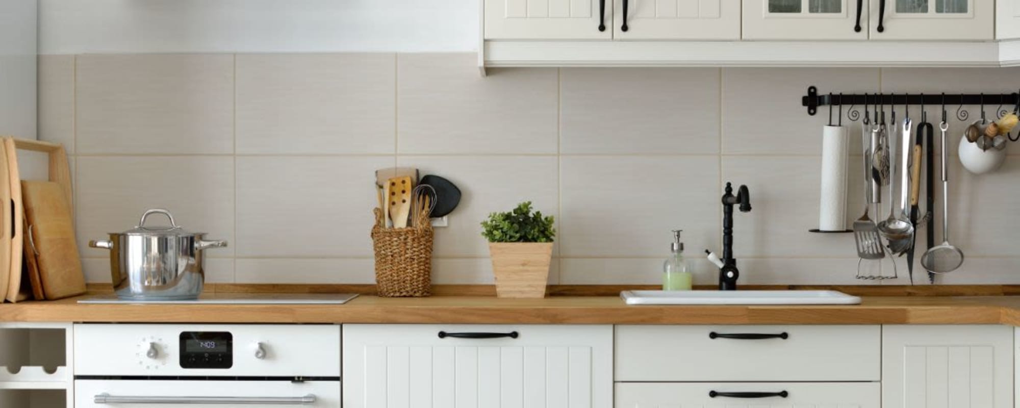 Model kitchen with modern backsplash at Merida in San Antonio, Texas