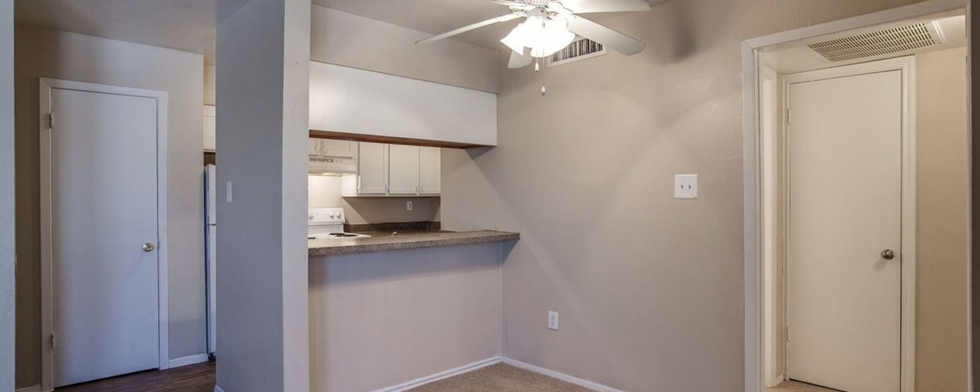 Kitchen area in a model home at Park Vista Apartments in San Antonio, Texas