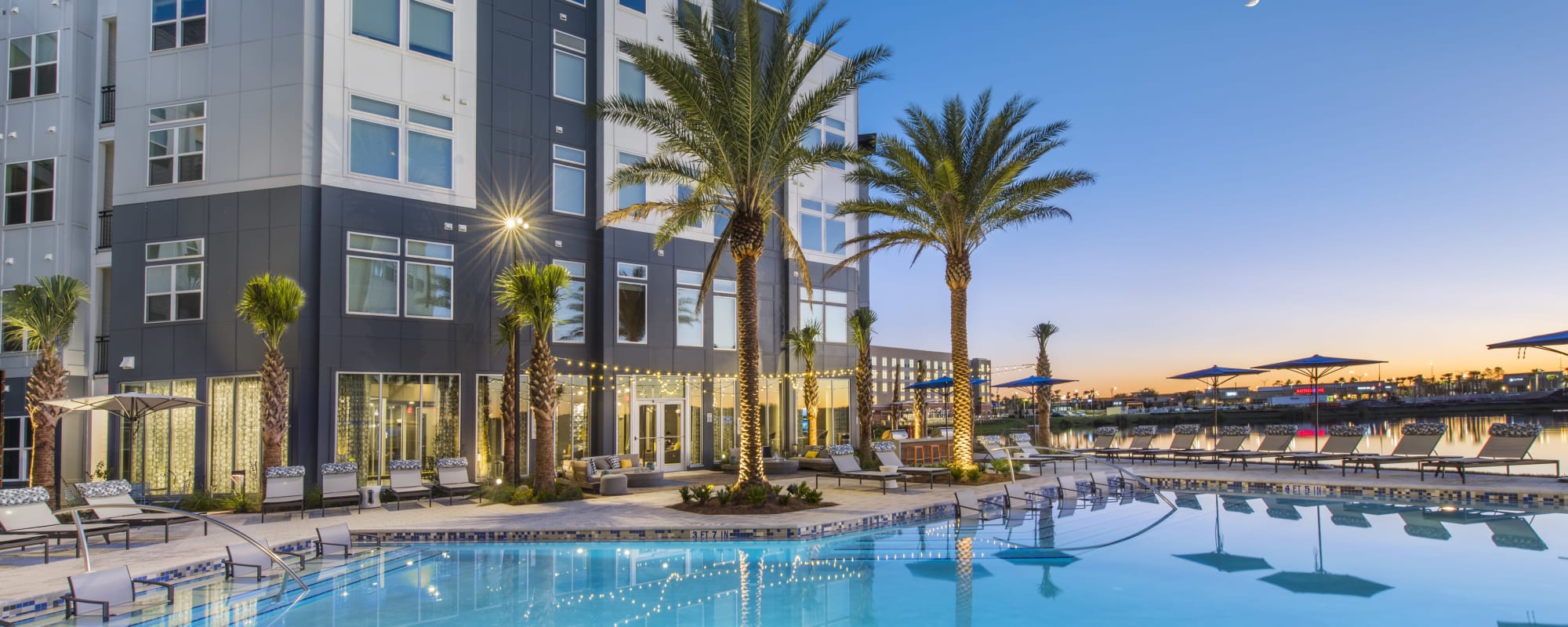 A sparkling community swimming pool at Ravella at Town Center in Jacksonville, Florida