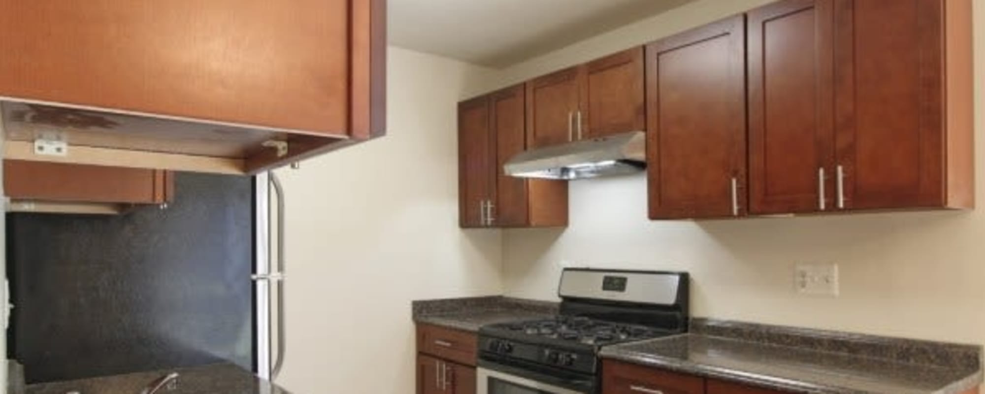 Apartment kitchen with stainless steel finishes at Chelsea Park in Gaithersburg, Maryland