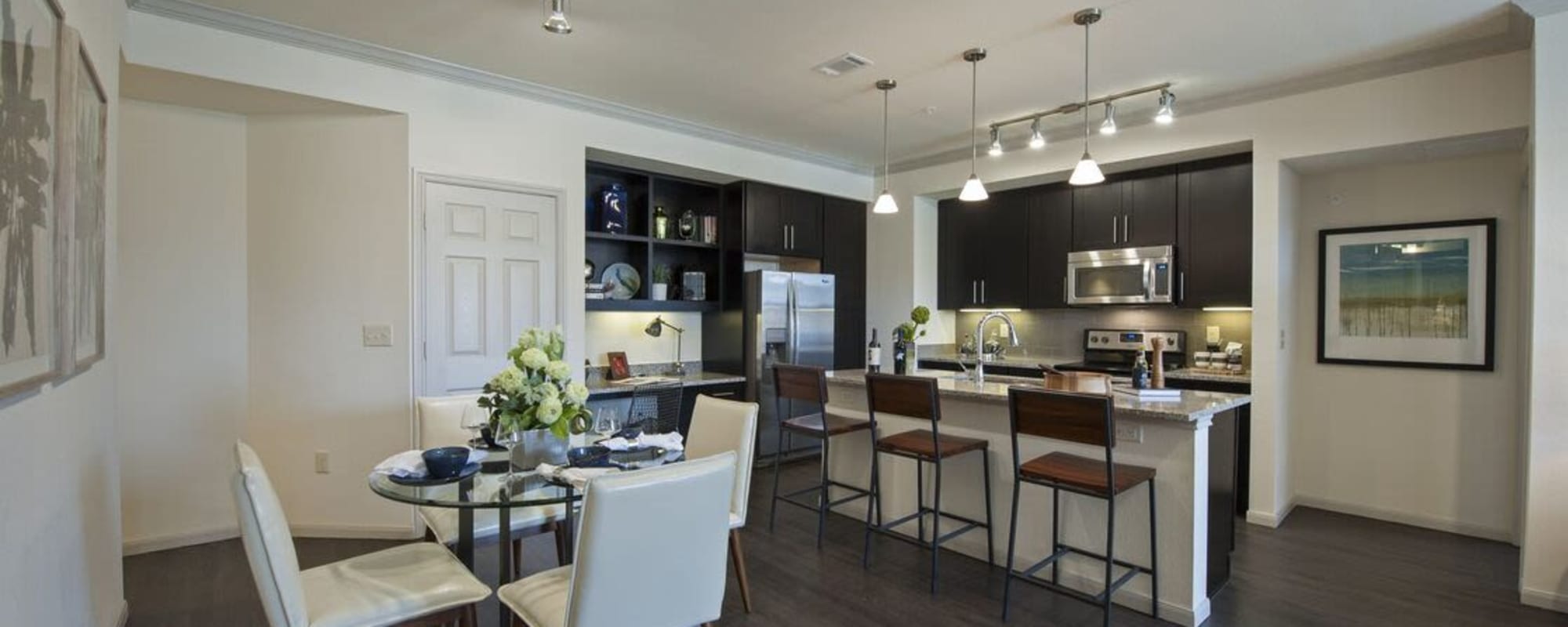 Dining room kitchen combo with a kitchen island at The Crossing at Katy Ranch in Katy, Texas