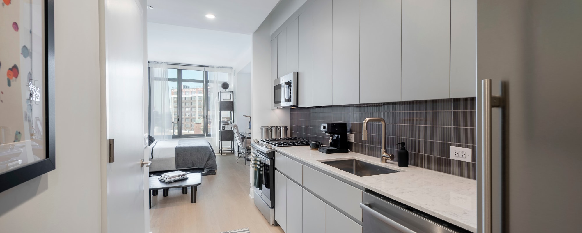 Rendering  beautiful kitchen on apartment model at 8 Court Square in Long Island City, New York