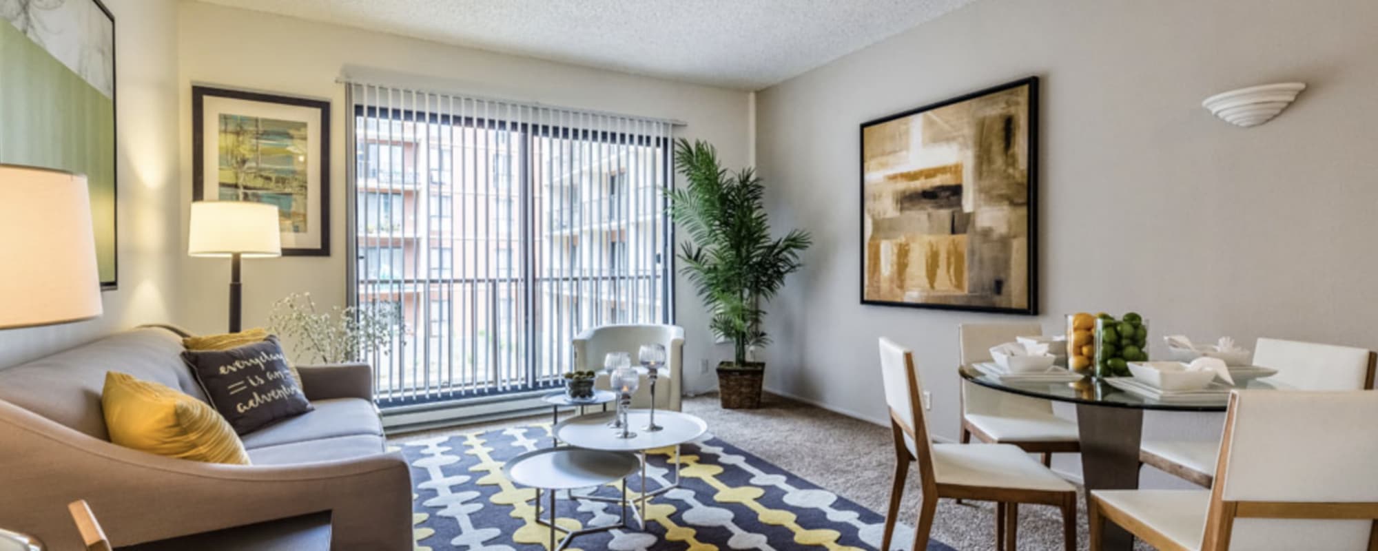 Model living room with an area rug at Lakewood Apartments at Lake Merced in San Francisco, California