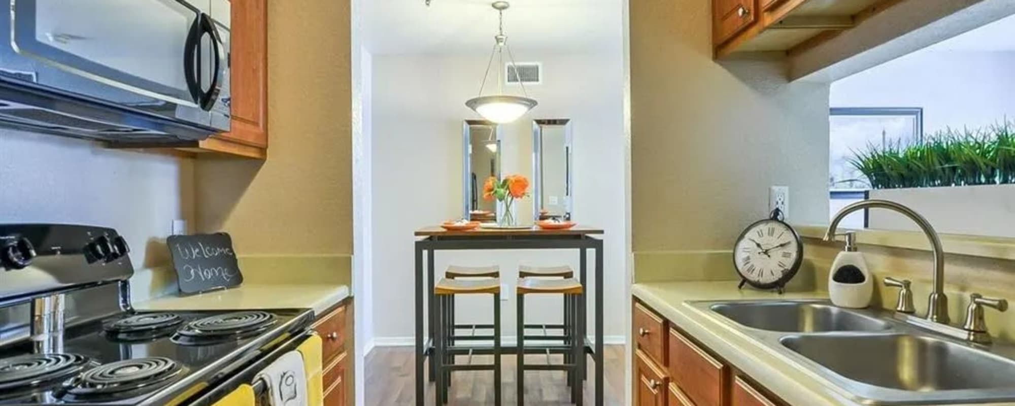 An apartment kitchen and dining room at Reserve at Stillwater in Durham, North Carolina