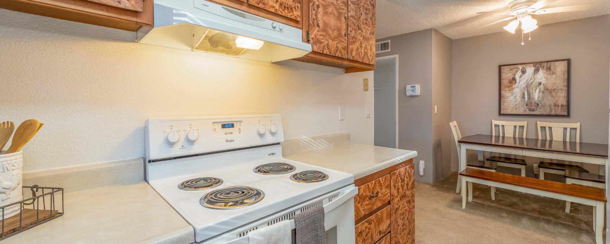 Kitchen with white appliances at Rosewood Park Apartments in Reno, Nevada