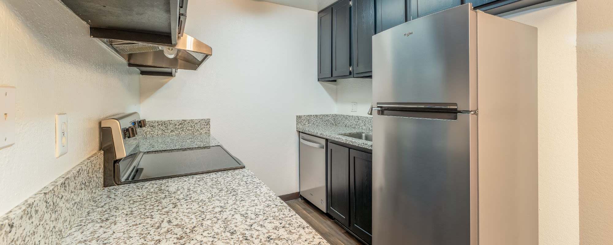 Stainless-steel appliances in an apartment kitchen at Rosewood Park Apartments in Reno, Nevada