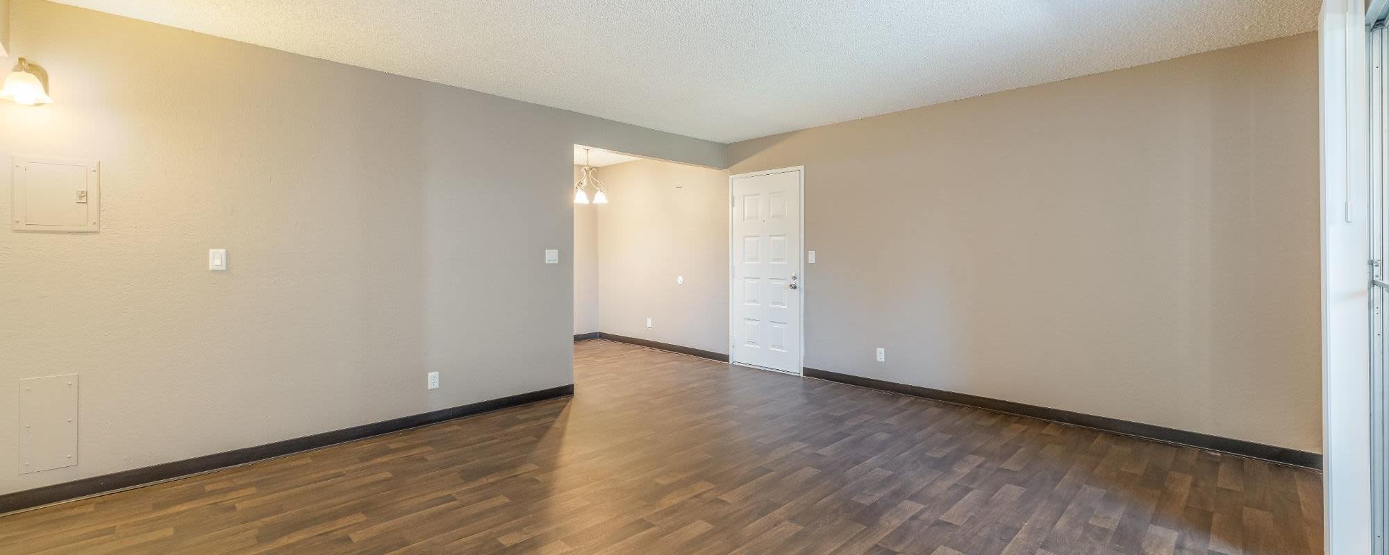 Model living room with hardwood floors at Rosewood Park Apartments in Reno, Nevada