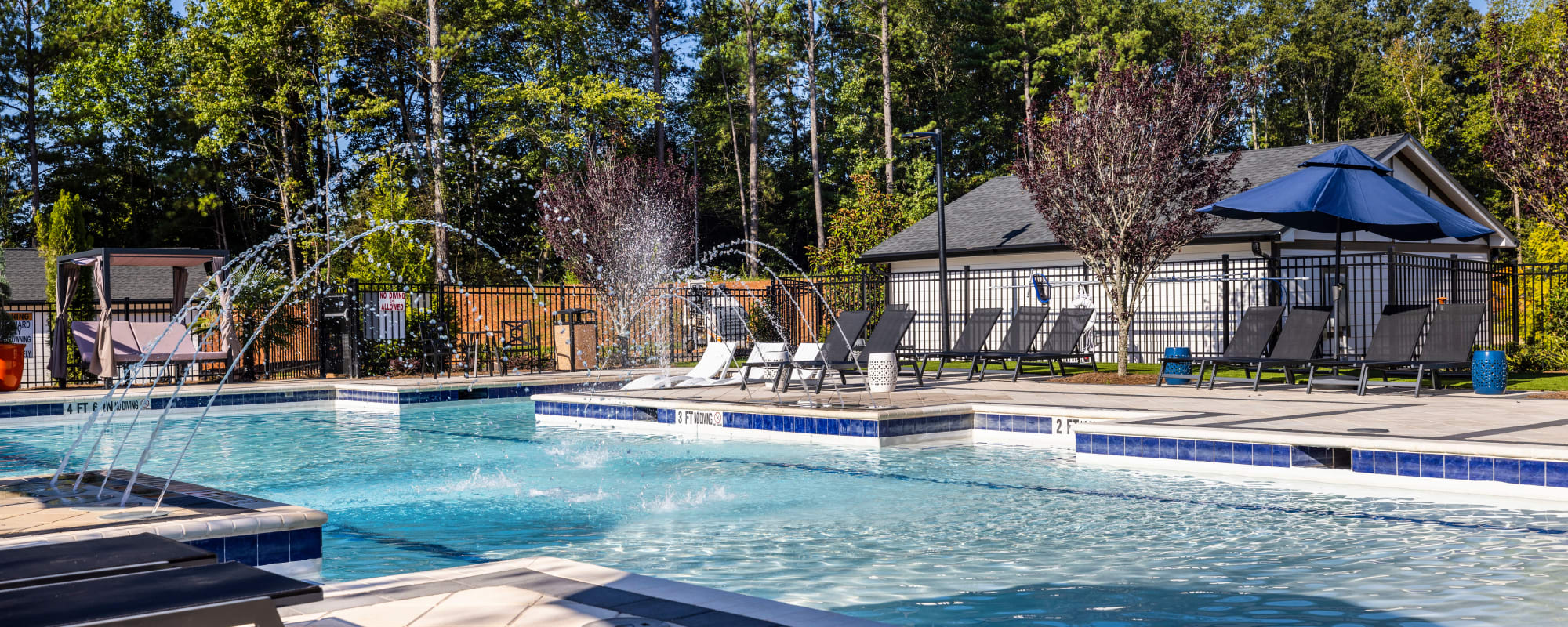 Luxurious swimming pool and outdoor lounge seating at Novo Stockbridge in Stockbridge, Georgia