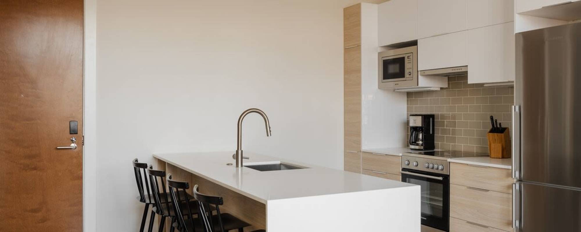 Kitchen with barstools at 313 RACE in Philadelphia, Pennsylvania