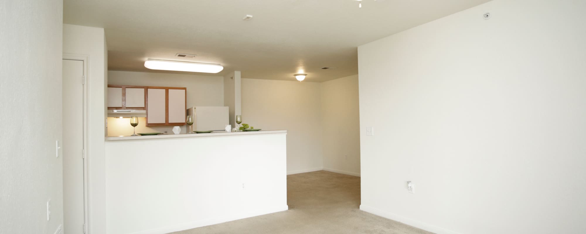 Kitchen with attached living room at North Oak Crossing in Kansas City, Missouri