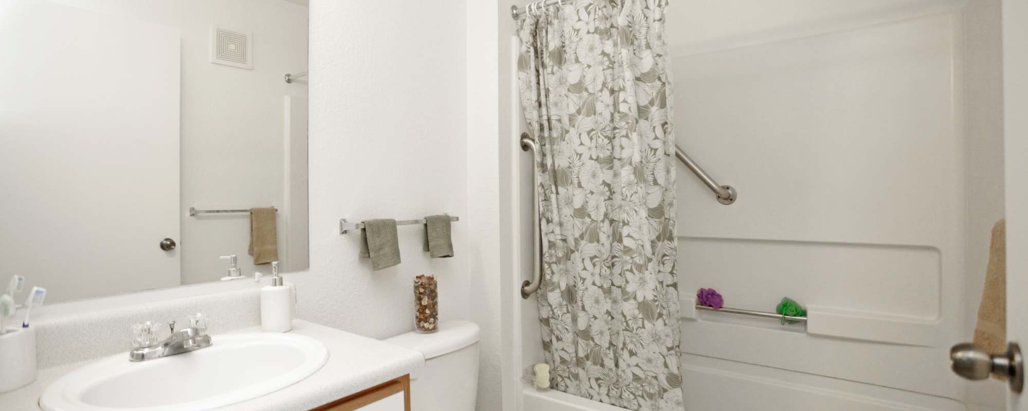 Apartment bathroom at North Oak Crossing in Kansas City, Missouri