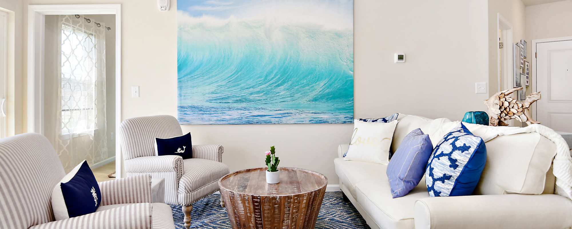 Living space with a couch and chairs at Oceans East in Berlin, Maryland