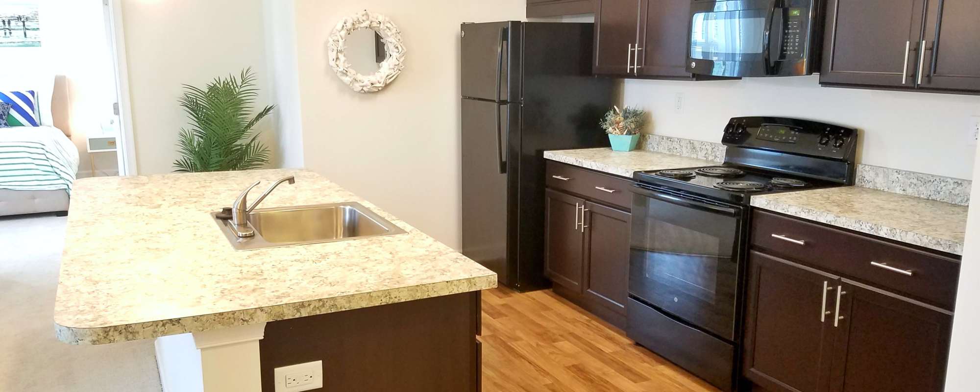 Kitchen with black appliances at Leander Lakes in Dover, Delaware