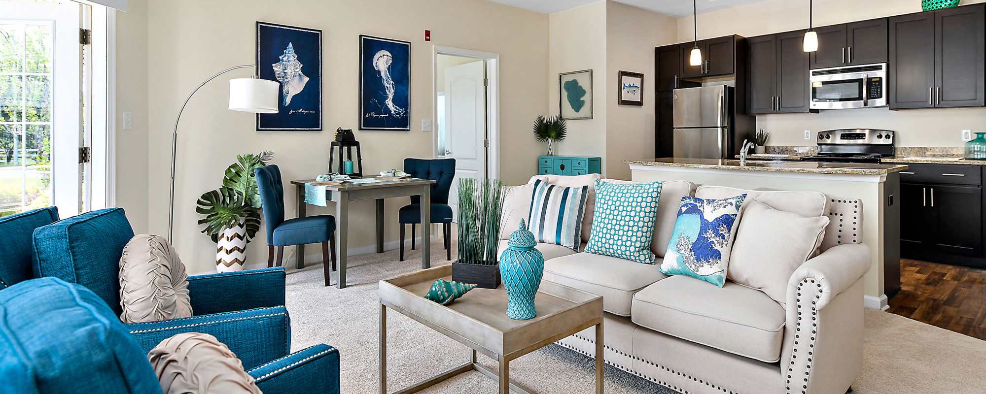 Living space with wood-style flooring at Ocean Aisle in Salisbury, Maryland