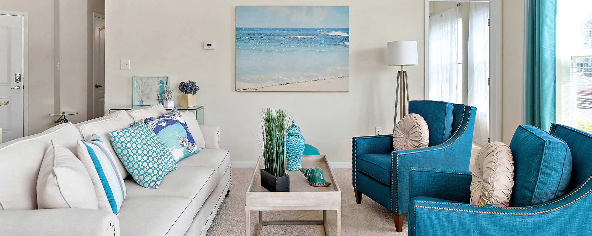 Living space with large windows at Ocean Aisle in Salisbury, Maryland
