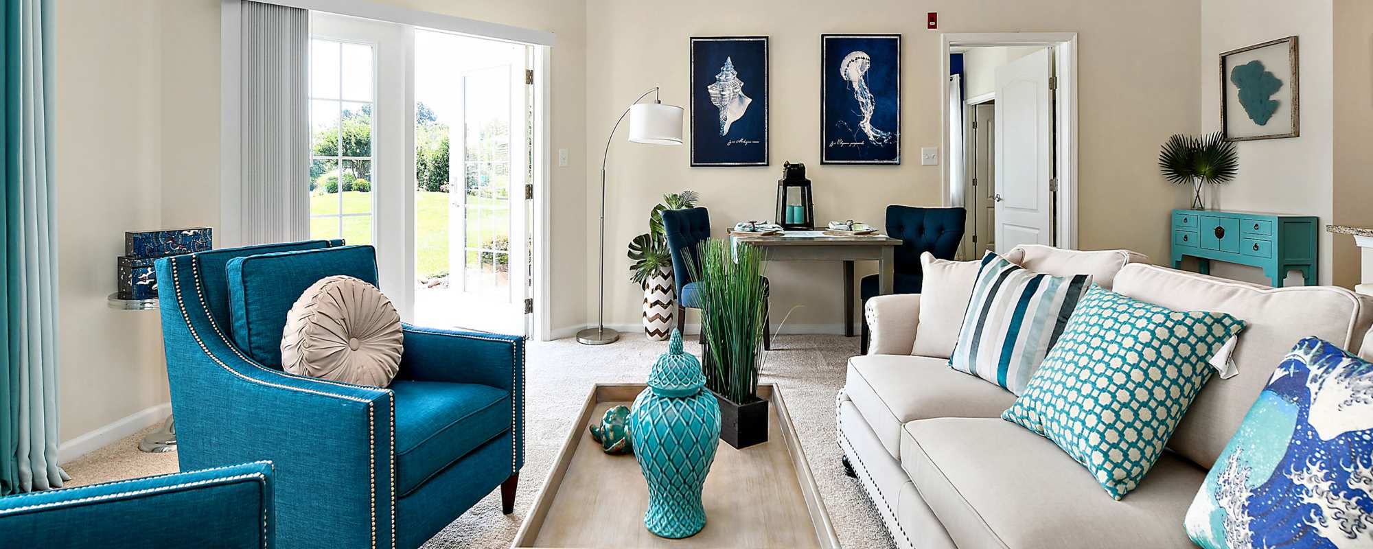 Living space with quick access to the patio or balcony at Ocean Aisle in Salisbury, Maryland