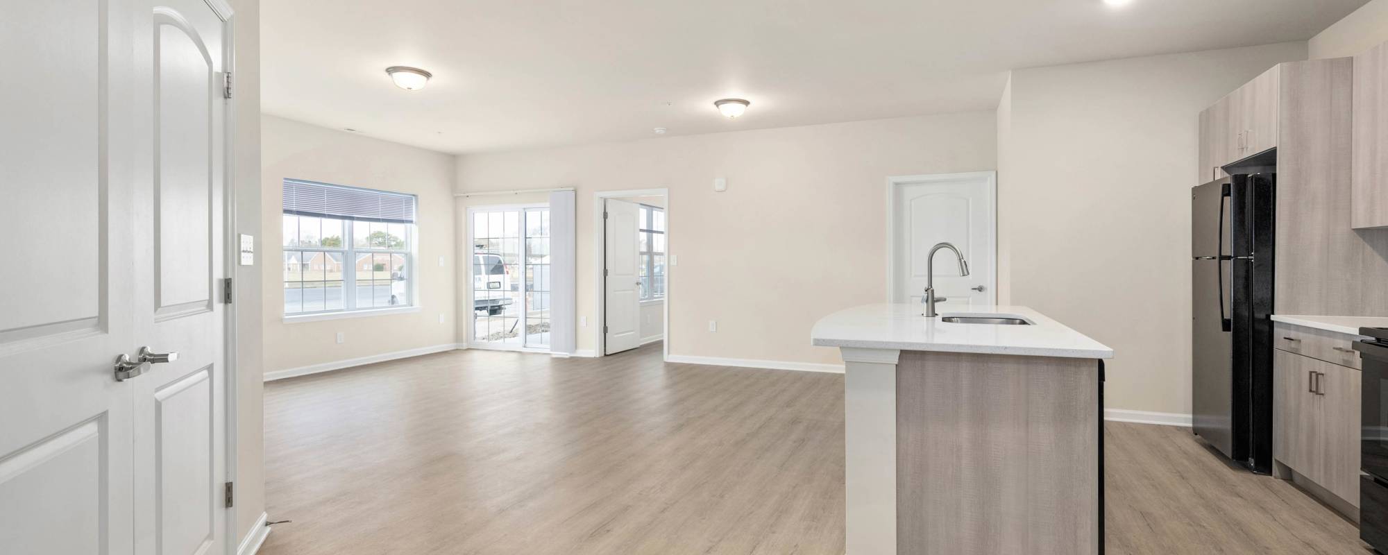 Kitchen and dinning space with wood-style flooring at Ocean Aisle in Salisbury, Maryland