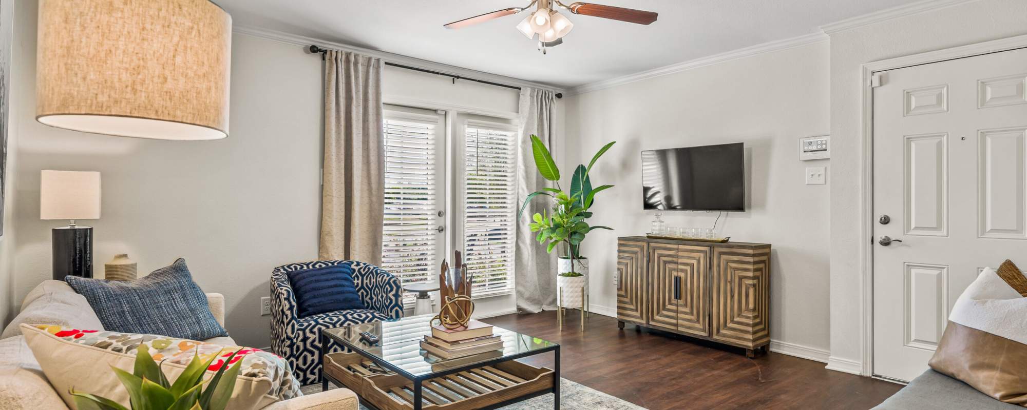 Living room with TV at Fern Crossing in Shreveport, Louisiana