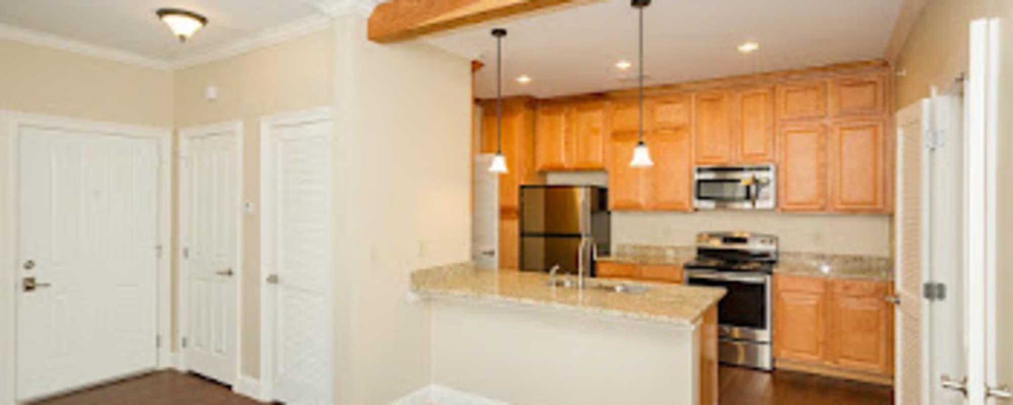 Kitchen with wooden cabinetries at Coates Bluff At Wright Island in Shreveport, Louisiana