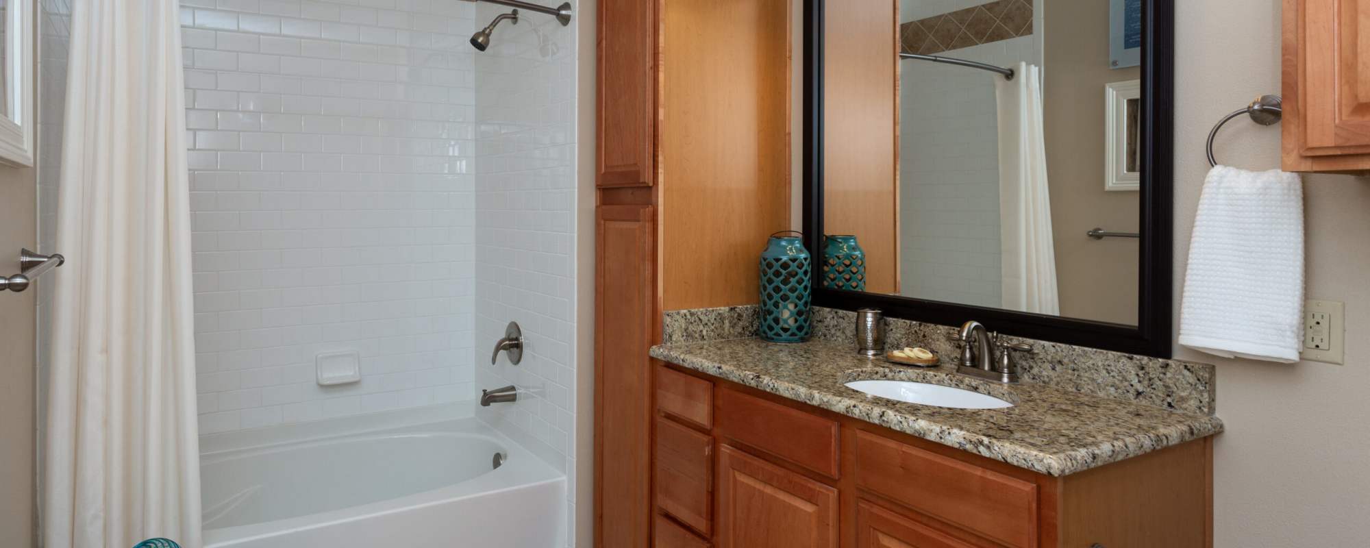 Bathroom with vanity mirror at Coates Bluff At Wright Island in Shreveport, Louisiana