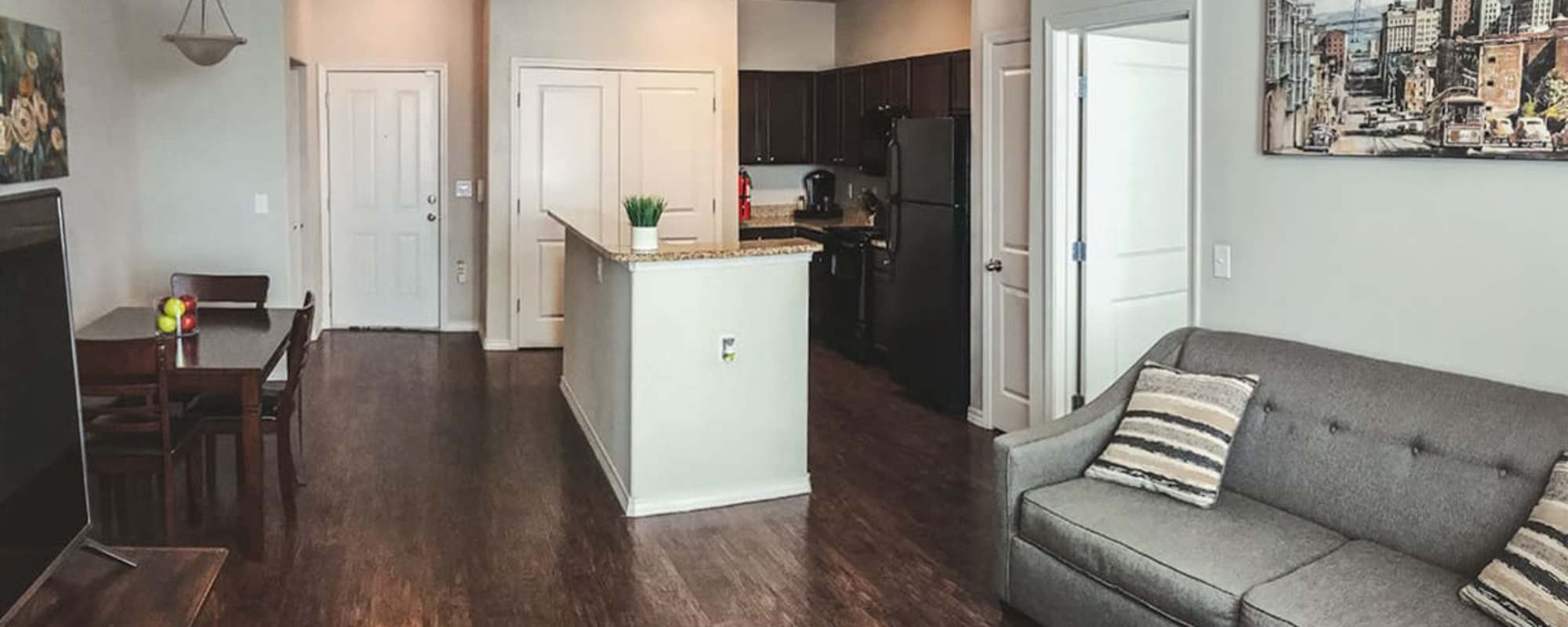 Living room with a view of kitchen at Le Rivage in Bossier City, Louisiana