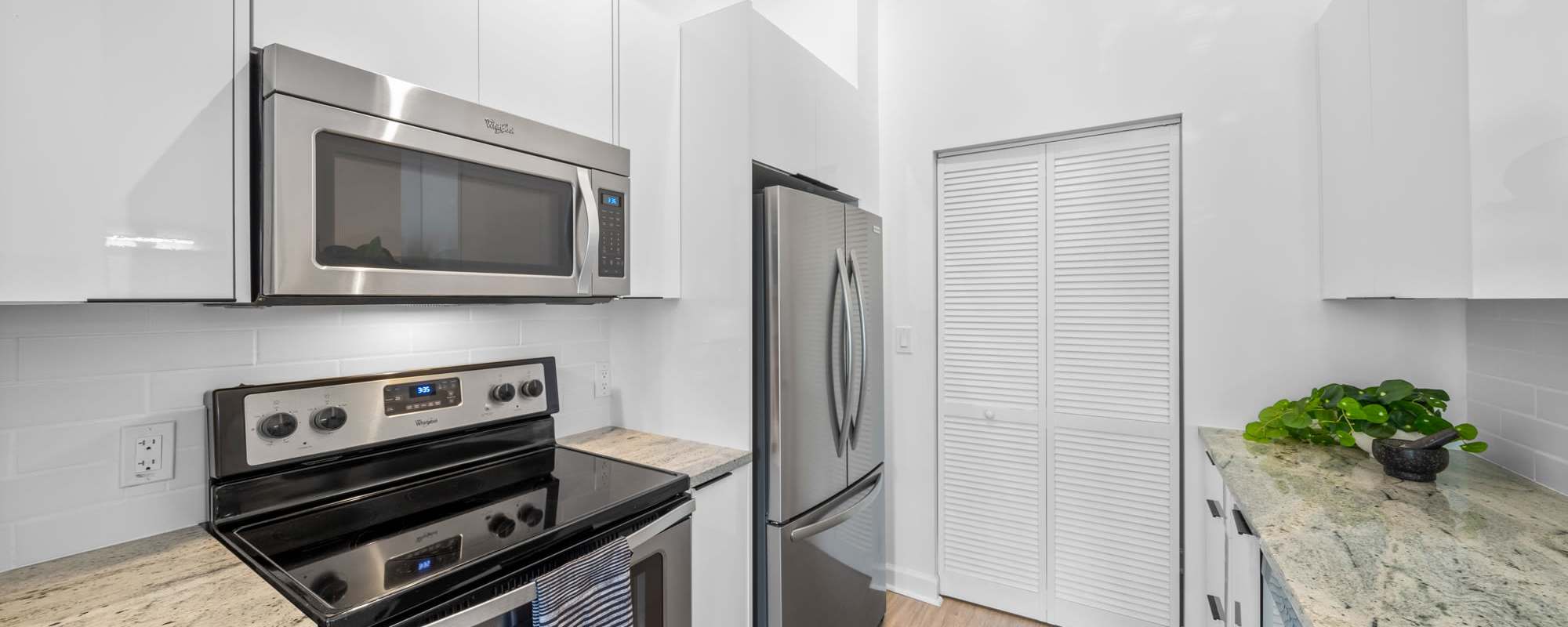 Stainless-steel appliances in an apartment kitchen at Cordoba in Doral, Florida