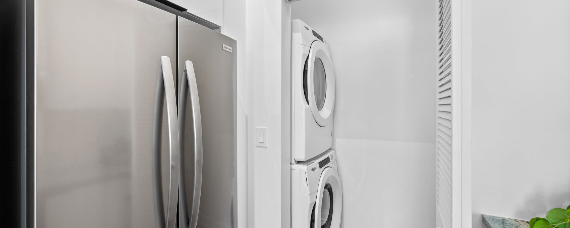 Stacked washer and dryer in a home at Cordoba in Doral, Florida