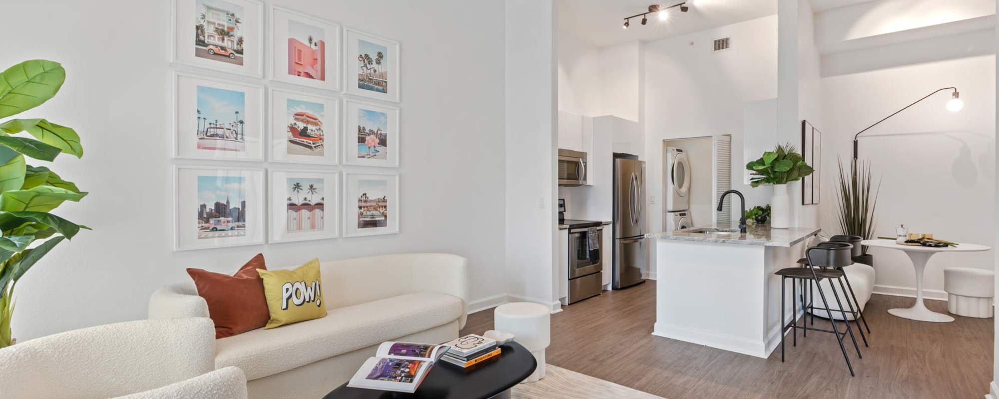 Tall ceilings in an apartment living room and kitchen area at Cordoba in Doral, Florida