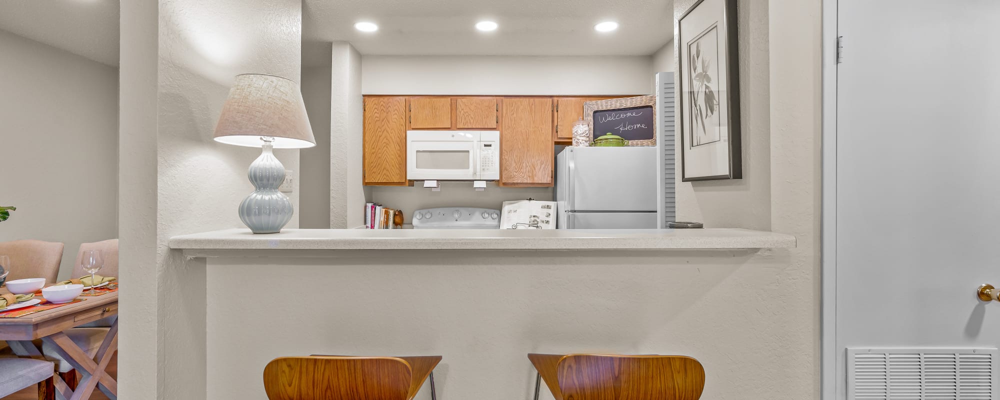 Kitchen with white appliances at Millicent Crossing in Shreveport, Louisiana